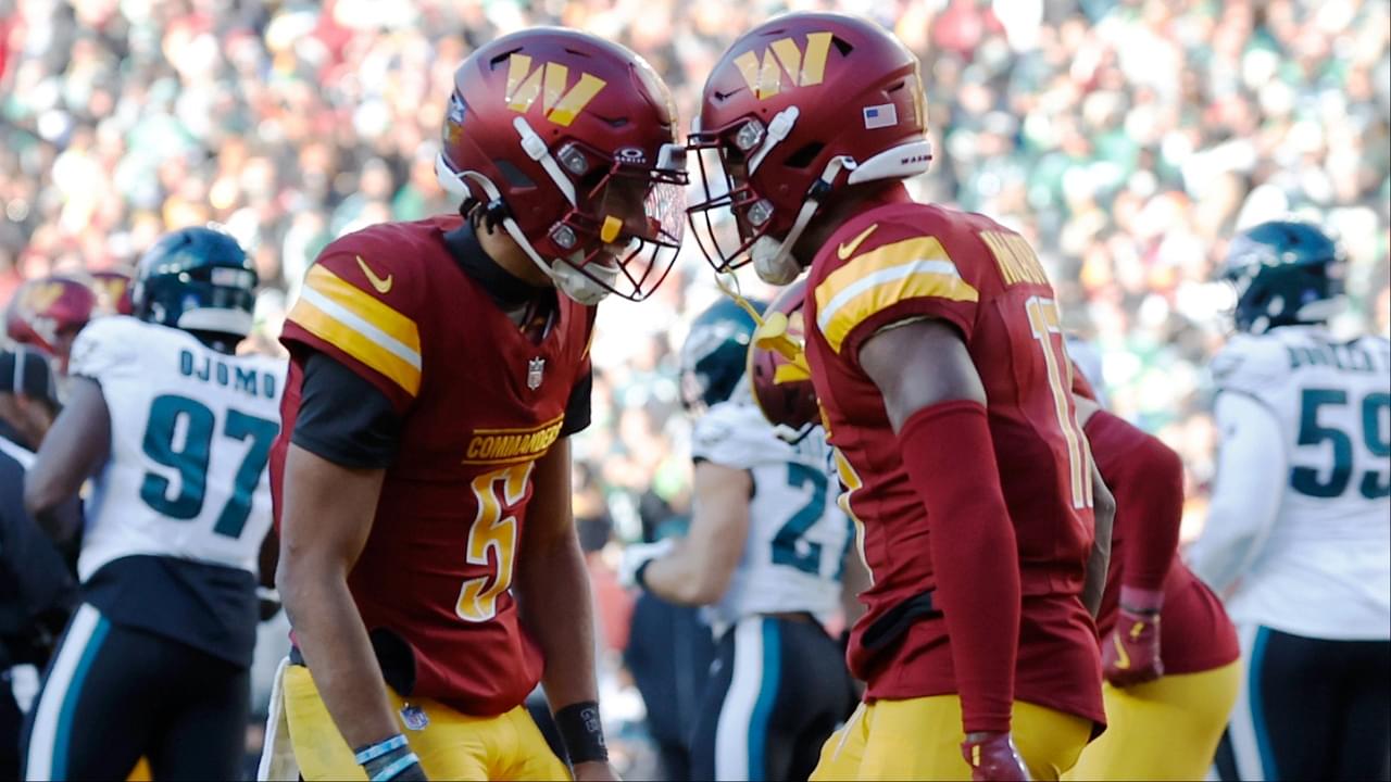 Washington Commanders quarterback Jayden Daniels (5) celebrates with Commanders wide receiver Terry McLaurin (17) after connecting on a touchdown pass against the Philadelphia Eagles during the second quarter at Northwest Stadium