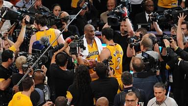 Los Angeles Lakers forward Kobe Bryant (24) meets with forward Larry Nance Jr. (7) following the 101-96 victory against Utah Jazz at Staples Center.