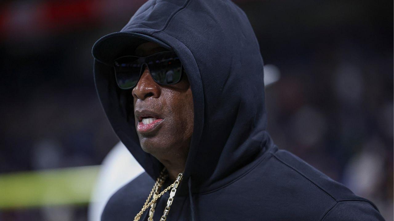 Colorado Buffaloes head coach Deion Sanders jogs on the field before the game against the Brigham Young Cougars at Alamodome.