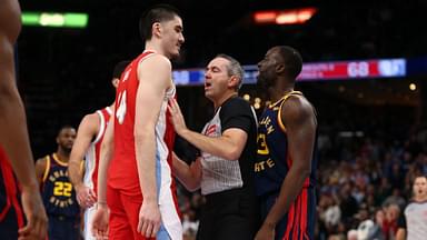 Memphis Grizzlies center Zach Edey (14) and Golden State Warriors forward Draymond Green (23) are separated by an official during the second quarter at FedExForum.