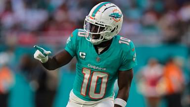 Dec 22, 2024; Miami Gardens, Florida, USA; Miami Dolphins wide receiver Tyreek Hill (10) signals from the line of scrimmage against the San Francisco 49ers during the second quarter at Hard Rock Stadium.