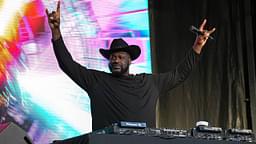 Shaquille O'Neal holds up the sign of the horns during a DJ performance ahead of the College Football Playoff semifinal game between the Texas Longhorns and Ohio State in the Cotton Bowl at AT&T Stadium