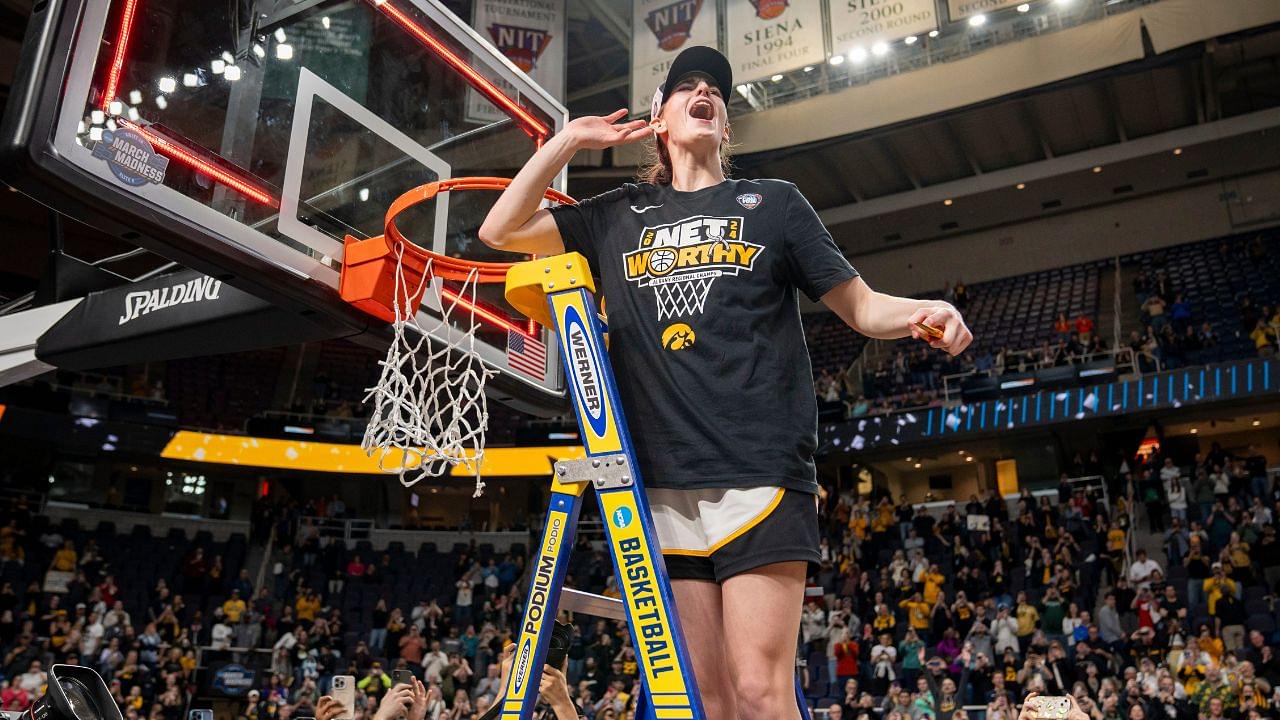 Iowa Hawkeyes guard Caitlin Clark (22) cuts down the net after beating LSU in the Elite 8 round of the NCAA Women's Basketball Tournament between Iowa and LSU at MVP Arena