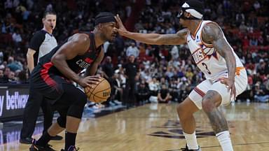 Miami Heat forward Jimmy Butler (22) is guarded by Phoenix Suns guard Bradley Beal (3) during the fourth quarter at Kaseya Center