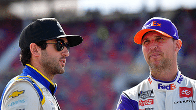 NASCAR Cup Series driver Chase Elliott (9) speaks with NASCAR Cup Series driver Denny Hamlin (11) during qualifying at Phoenix Raceway.