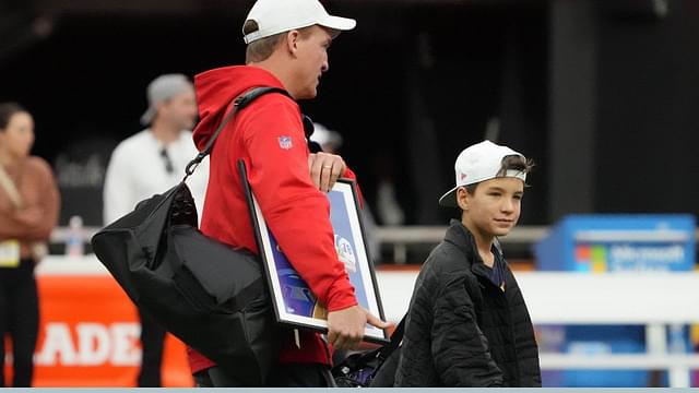 AFC coach Peyton Manning (left) and son Marshall Manning during Pro Bowl Games practice at Allegiant Stadium.