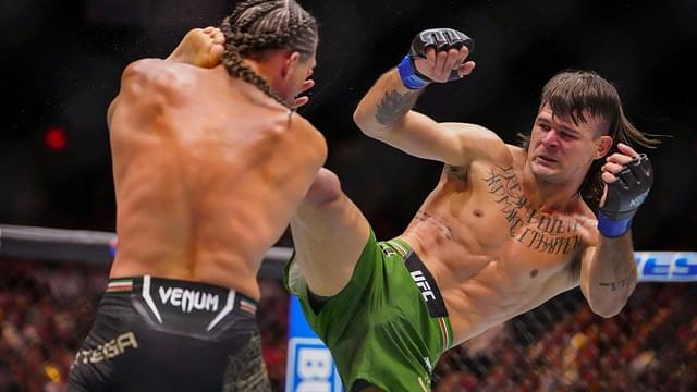 Brian Ortega of the United States (red gloves) fights Diego Lopes of Brazil (blue bloves) during Riyadh Season Noche UFC 306 at The Sphere.