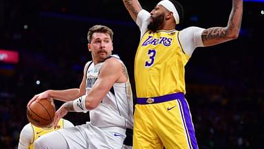 Dallas Mavericks guard Luka Doncic (77) passes the ball against Los Angeles Lakers forward Anthony Davis (3) during the first half at Crypto.com Arena.