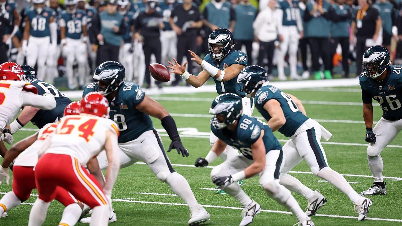 Philadelphia Eagles quarterback Jalen Hurts (1) takes a snap against the Kansas City Chiefs during the second half of Super Bowl LIX at Caesars Superdome.