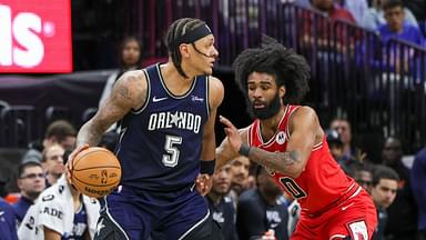 Orlando Magic forward Paolo Banchero (5) moves the ball around Chicago Bulls guard Coby White (0) during the second half at KIA Center.