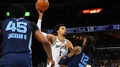 San Antonio Spurs center Victor Wembanyama (1) drives to the basket as Memphis Grizzlies guard Ja Morant (12) defends during the fourth quarter at FedExForum.