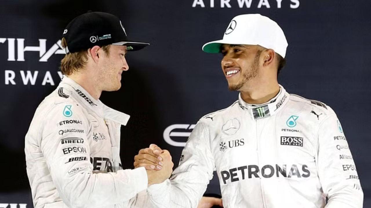 Abu Dhabi Grand Prix – Yas Marina Circuit, Abu Dhabi, United Arab Emirates – 27 11 2016 – Mercedes Formula One driver Nico Rosberg (L) of Germany shakes hands with Lewis Hamilton of Britain