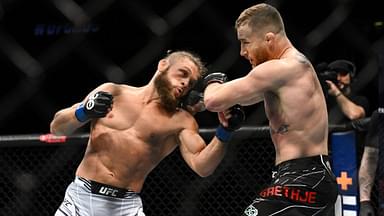 Justin Gaethje (red gloves) fights Rafael Fiziev (blue gloves) during UFC 286 at O2 Arena.