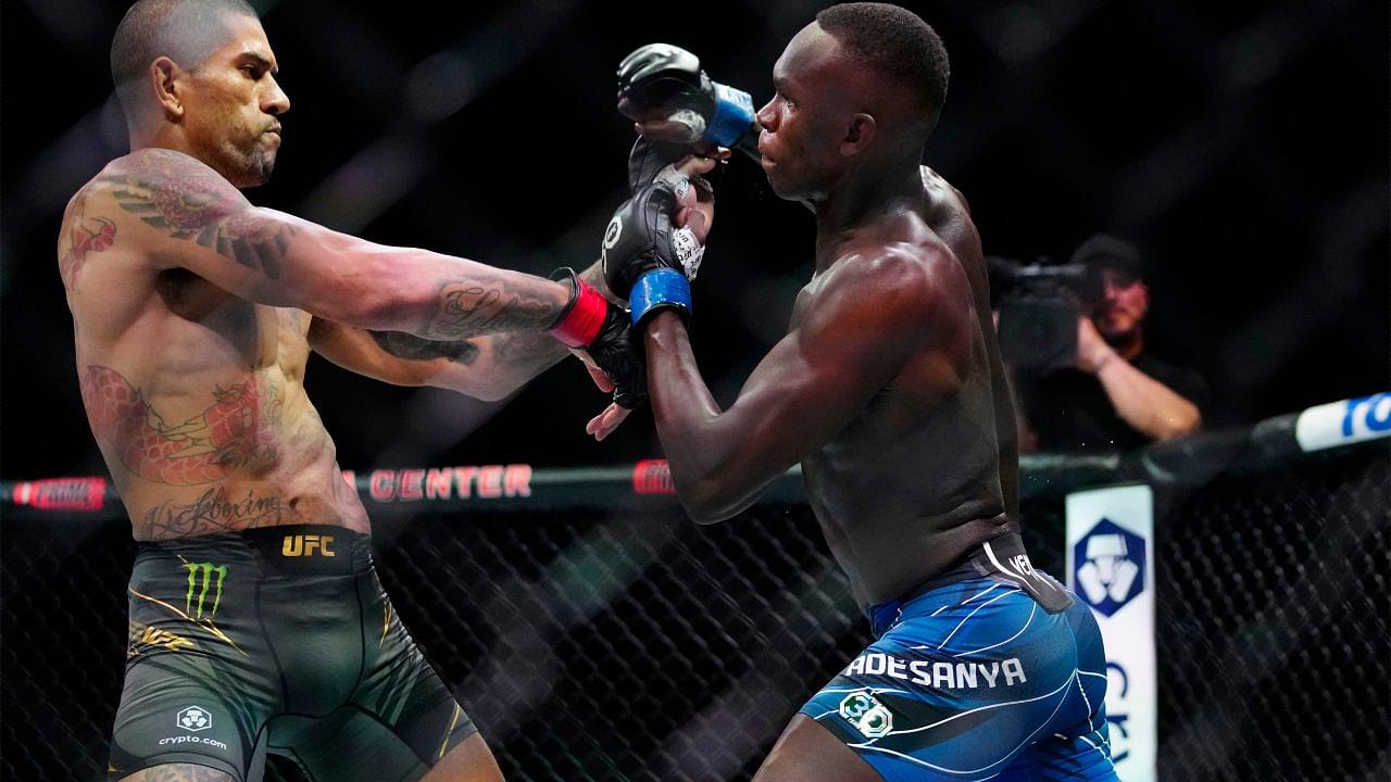 Alex Pereira (red gloves) fights Israel Adesanya (blue gloves) during UFC 287 at Miami-Dade Arena.