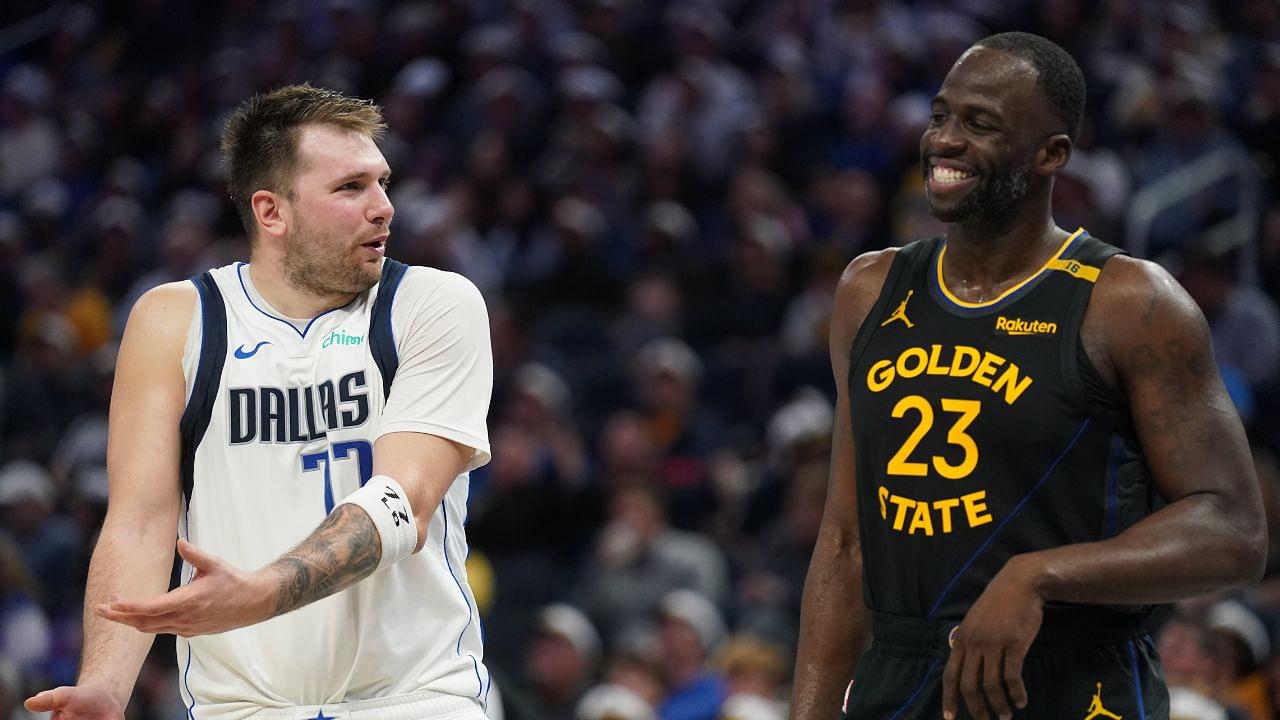 Dallas Mavericks guard Luka Doncic (77) talks with Golden State Warriors forward Draymond Green (23) after being called for a foul in the fourth quarter at the Chase Center