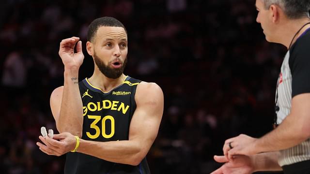 Golden State Warriors guard Stephen Curry (30) talks to official Brett Nansel in the first half against the Houston Rockets at Toyota Center.