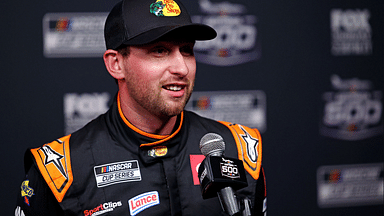 Feb 12, 2025; Daytona Beach, Florida, USA; NASCAR Cup Series driver Chase Briscoe (19) during Daytona 500 media day at Daytona International Speedway. Mandatory Credit: Peter Casey-Imagn Images