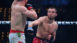 Merab Dvalishvili (red gloves) fights Umar Nurmagomedov (blue gloves) during UFC 311 at Intuit Dome.