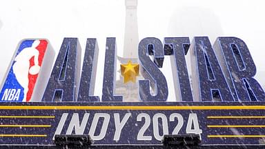 Snow falls Friday, Feb. 16, 2024, in front of an NBA All-Star Indy 2024 sign on Monument Circle in Indianapolis.