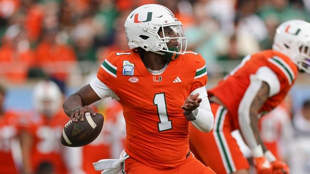 Dec 28, 2024; Orlando, FL, USA; Miami Hurricanes quarterback Cam Ward (1) drops back to pass against the Iowa State Cyclones in the first quarter during the Pop Tarts bowl at Camping World Stadium.