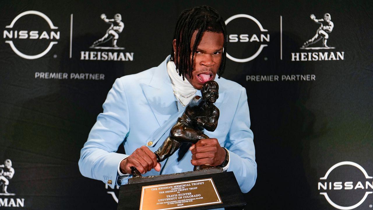 Colorado Buffaloes wide receiver/cornerback Travis Hunter poses for a photo after winning the Heisman Trophy award during the 2024 Heisman Trophy Presentation.