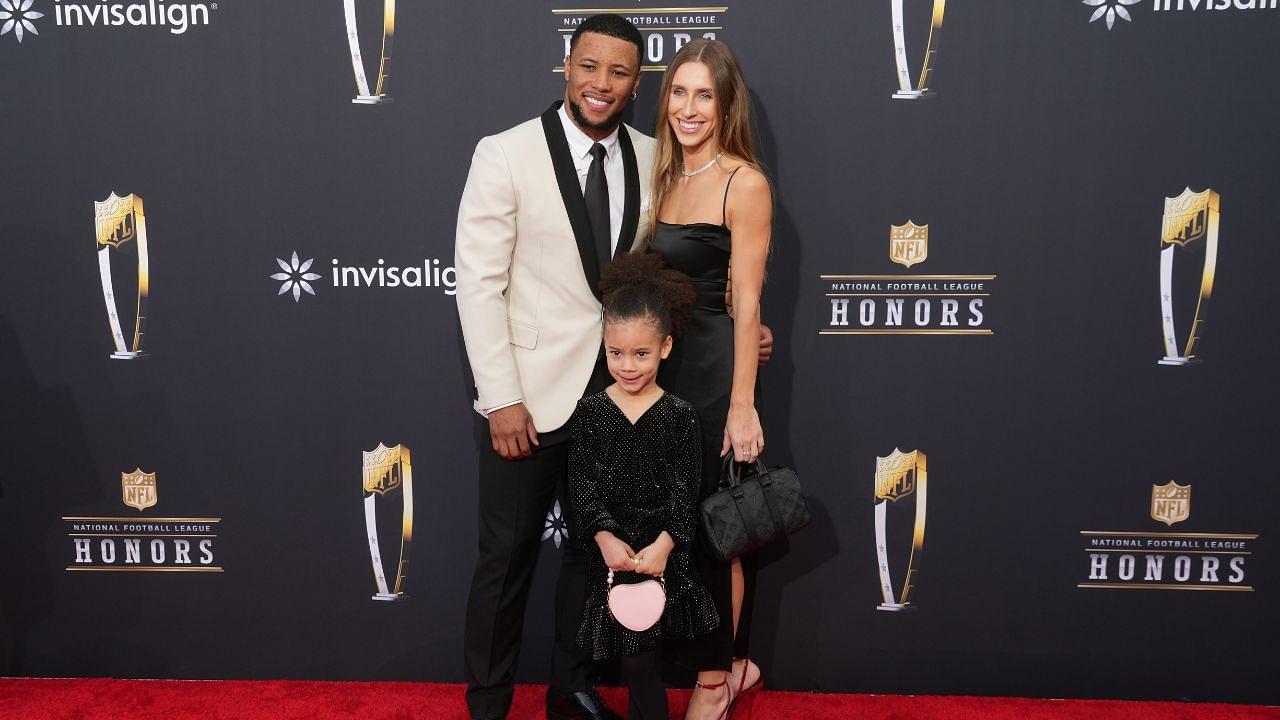 Saquon Barkley with Anna Congdon and daughter Jada Clare Barkley on the red carpet before the NFL Honors show at Resorts World Theatre.