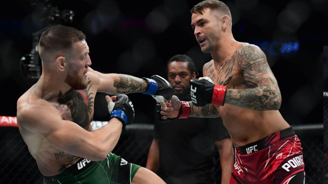 Dustin Poirier moves in for a hit against Conor McGregor during UFC 264 at T-Mobile Arena.