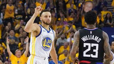 Golden State Warriors guard Stephen Curry (30) celebrates against LA Clippers guard Lou Williams (23) during the first quarter in game one of the first round of the 2019 NBA Playoffs at Oracle Arena.