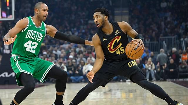 Boston Celtics center Al Horford (42) defends Cleveland Cavaliers guard Donovan Mitchell (45) in the first quarter at Rocket Mortgage FieldHouse