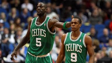 Boston Celtics forward Kevin Garnett (5) taps the head of guard Rajon Rondo (9) during the first quarter against the Minnesota Timberwolves at the Target Center. The Celtics defeated the Timberwolves 100-79