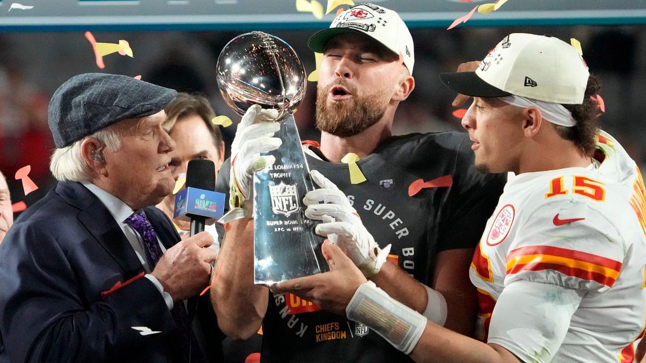 Kansas City Chiefs quarterback Patrick Mahomes passes the the Lombardi Trophy to Travis Kelce after winning the Super Bowl against the Philadelphia Eagles at State Farm Stadium