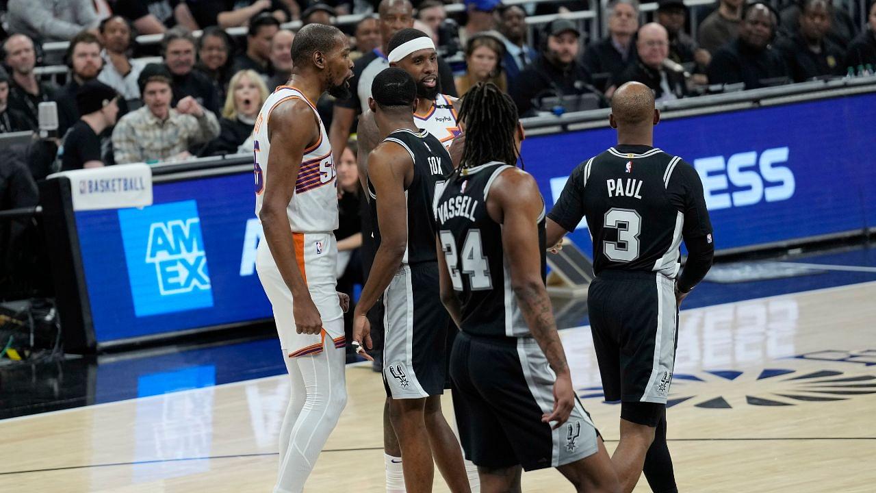 Phoenix Suns forward Kevin Durant (35) and San Antonio Spurs guard Chris Paul (3) exchange words during the first half at Moody Center.