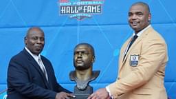 Aug 6, 2022; Canton, OH, USA; Richard Seymour (right) and presenter Titus Duren pose with bust of Seymour during the Pro Football Hall of Fame Class of 2022 Enshrinement at Tom Benson Hall of Fame Stadium.