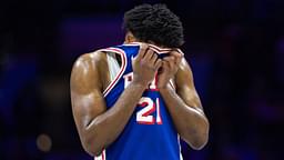 Philadelphia 76ers center Joel Embiid (21) wipes his face during a break in the third quarter against the Boston Celtics at Wells Fargo Center.