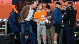 Former Denver Broncos player Peyton Manning with his son Marshall before the game against the Cleveland Browns at Empower Field at Mile High.