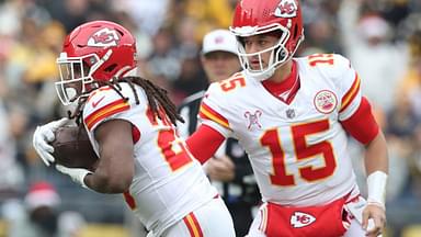 Kansas City Chiefs running back Kareem Hunt (29) takes a hand-off from quarterback Patrick Mahomes (15) against the Pittsburgh Steelers during the first quarter at Acrisure Stadium.