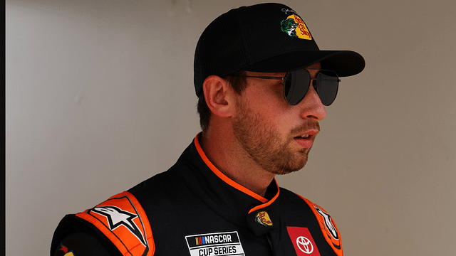 Feb 16, 2025; Daytona Beach, Florida, USA; NASCAR Cup Series driver Chase Briscoe (19) walks to the drivers meeting before the Daytona 500 at Daytona International Speedway. Mandatory Credit: Peter Casey-Imagn Images