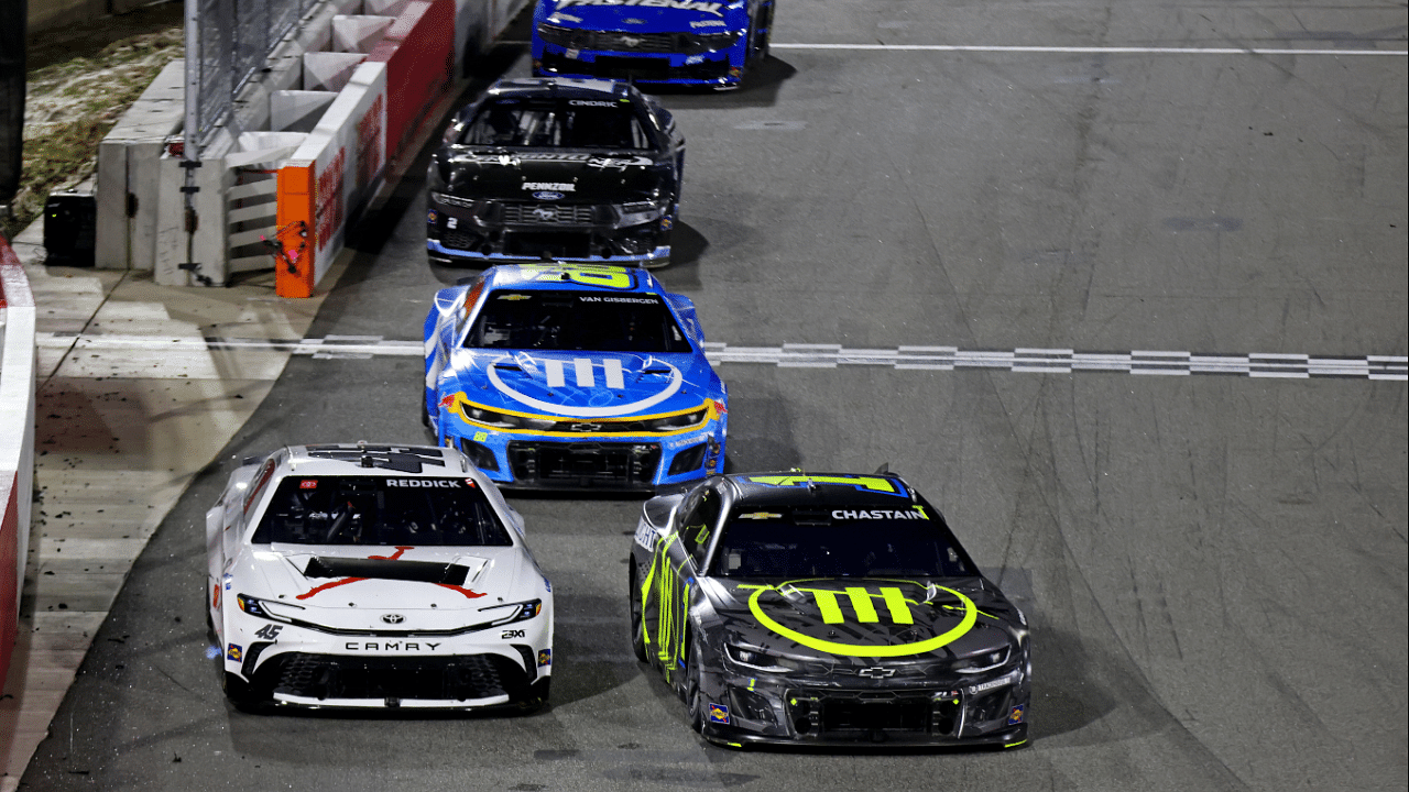 Feb 2, 2025; WInston-Salem, North Carolina, USA; NASCAR Cup Series driver Tyler Reddick (45) and NASCAR Cup Series driver Ross Chastain (1) during the Clash at Bowman Gray at Bowman Gray Stadium. Mandatory Credit: Peter Casey-Imagn Images