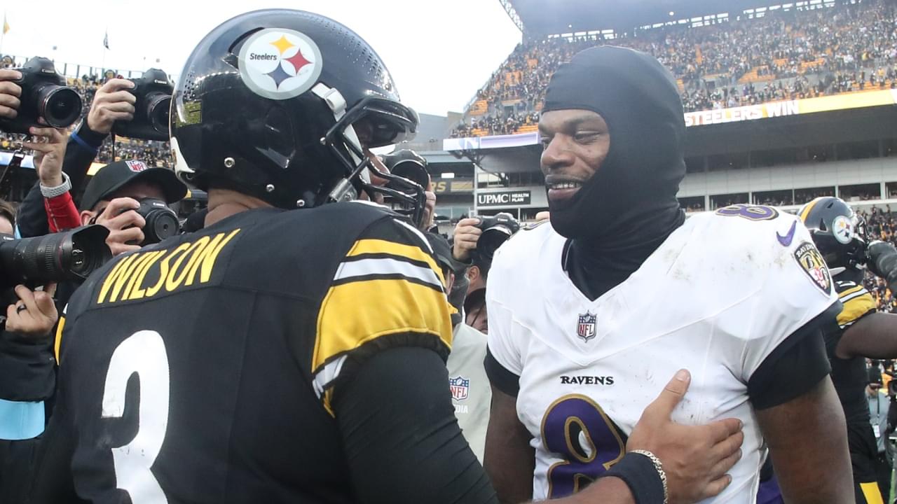 Nov 17, 2024; Pittsburgh, Pennsylvania, USA; Pittsburgh Steelers quarterback Russell Wilson (3) and Baltimore Ravens quarterback Lamar Jackson (8) meet at mid-field after playing at Acrisure Stadium.