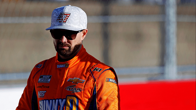 Feb 1, 2025; WInston-Salem, North Carolina, USA; NASCAR Cup Series driver Ricky Stenhouse Jr. (47) walks the track before practice for the Clash at Bowman Gray at Bowman Gray Stadium. Mandatory Credit: Peter Casey-Imagn Images