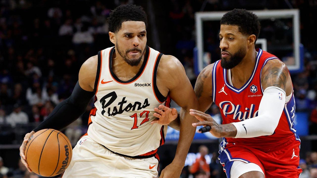 Detroit Pistons forward Tobias Harris (12) dribbles defended by Philadelphia 76ers forward Paul George (8) in the second half at Little Caesars Arena.