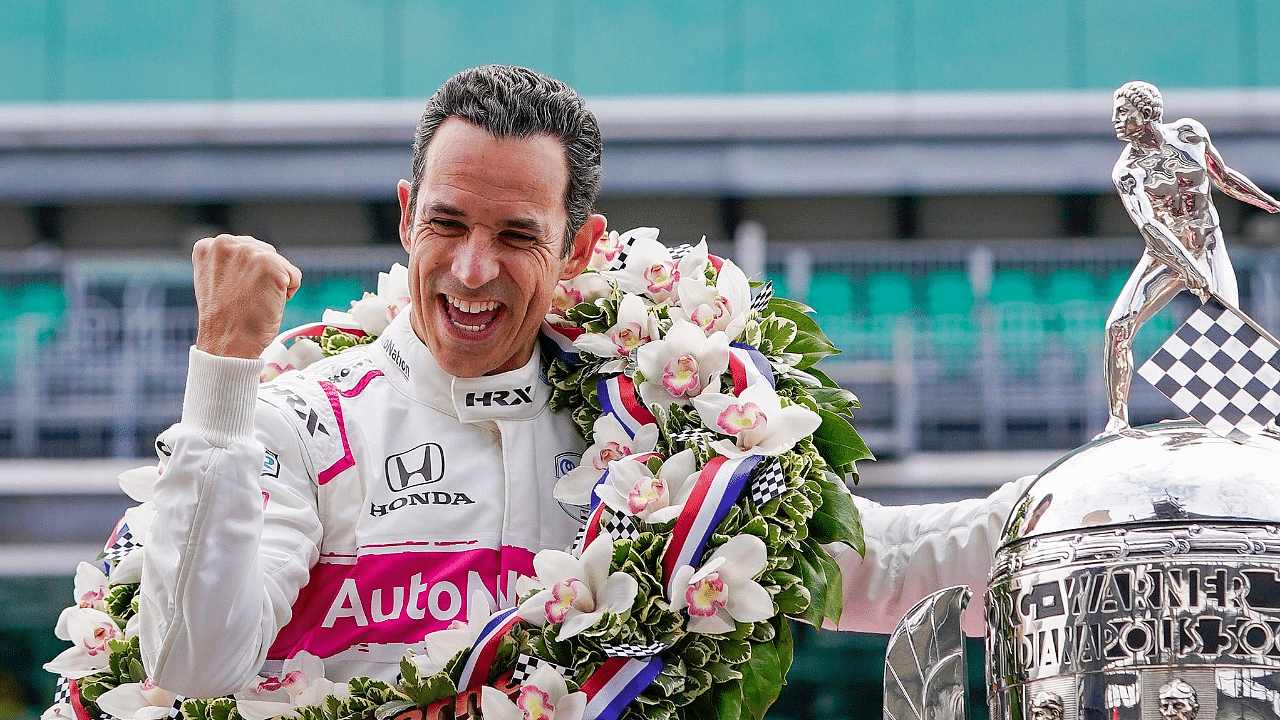 Helio Castroneves celebrates winning the105th Indianapolis 500 on May 31, 2021, tying the record for most wins in Indy 500 history.