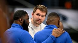 Dallas Mavericks guard Luka Doncic (center) talks with team staff during the second quarter against the Denver Nuggets at the American Airlines Center.