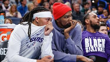 Phoenix Suns guard Damion Lee (10) and Phoenix Suns forward Kevin Durant (35) watch their team play against the Oklahoma City Thunder during the second half of a game at Paycom Center.