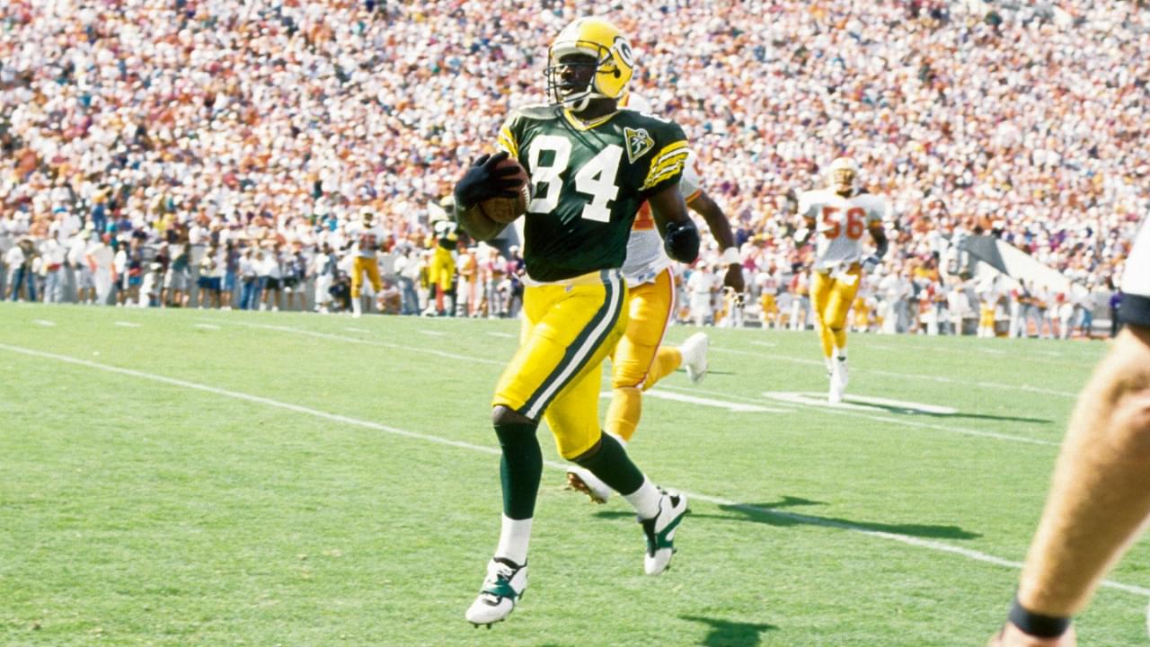 Oct 24, 1993; Tampa, FL, USA; Green Bay Packers receiver Sterling Sharpe (84) scores a touchdown against the Tampa Bay Buccaneers at Tampa Stadium.