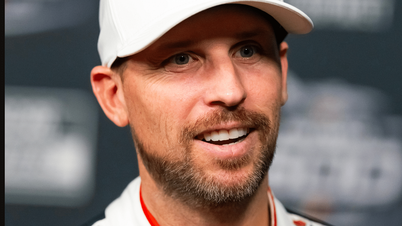 Feb 12, 2025; Daytona Beach, Florida, USA; NASCAR Cup Series driver Denny Hamlin during Daytona 500 media day at Daytona International Speedway. Mandatory Credit: Mark J. Rebilas-Imagn Images