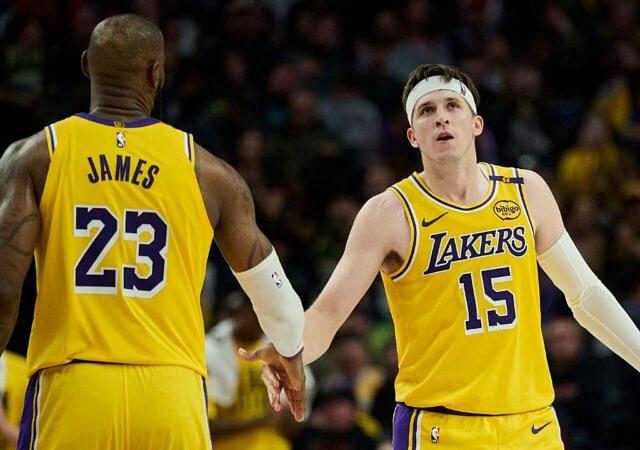 Los Angeles Lakers guard Austin Reaves (15) high fives forward LeBron James (23) during the second half against the Portland Trail Blazers at Moda Center.