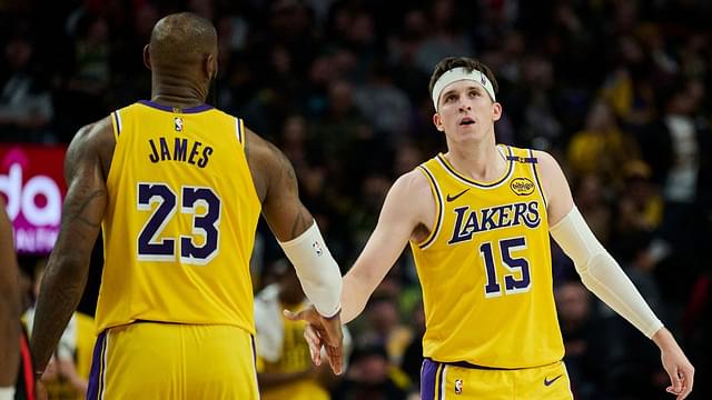 Los Angeles Lakers guard Austin Reaves (15) high fives forward LeBron James (23) during the second half against the Portland Trail Blazers at Moda Center.