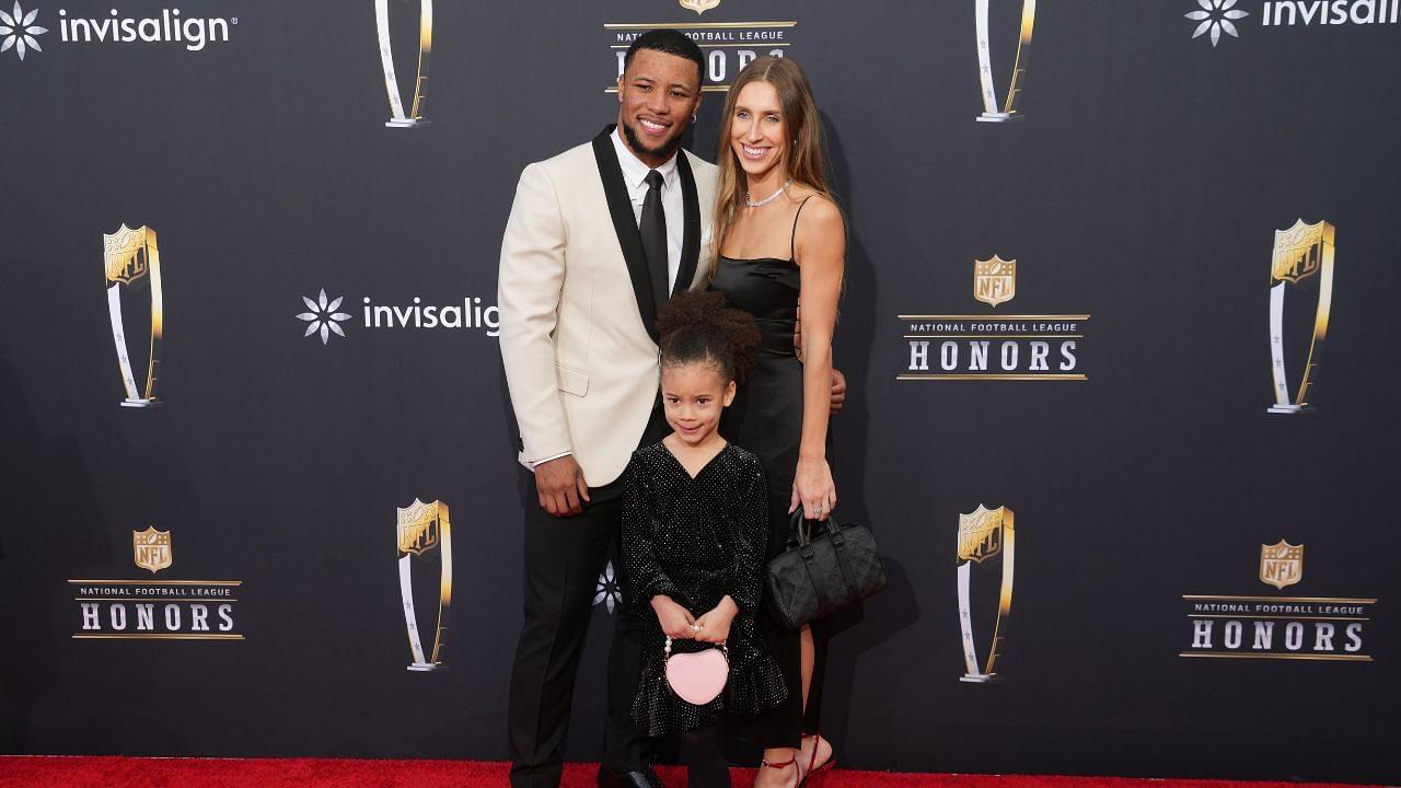 Saquan Barkley with Anna Congdon and daughter Jada Clare Barkley on the red carpet before the NFL Honors show at Resorts World Theatre.