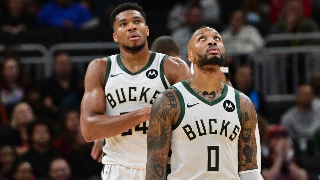 Milwaukee Bucks forward Giannis Antetokounmpo (34) and guard Damian Lillard (0) look on in the second quarter against the Chicago Bulls at Fiserv Forum.